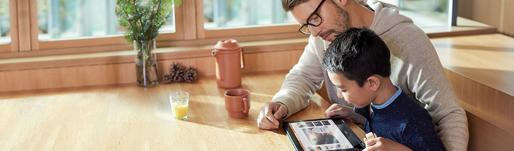 parent supporting child using windows 10 device