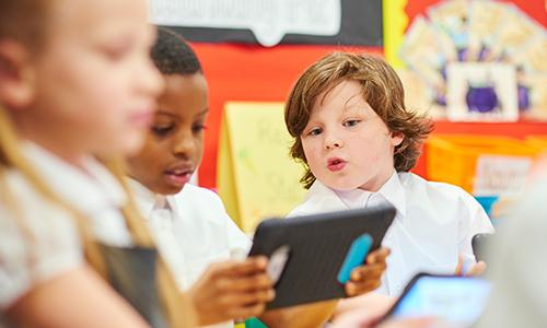 Primary school students using windows 10 tablets