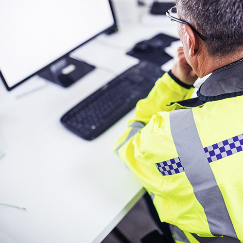 Emergency service officer using dektop pc