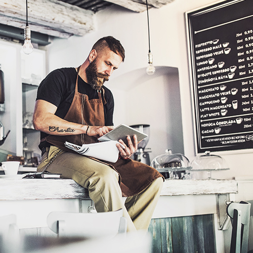 Small business owner using mobile device