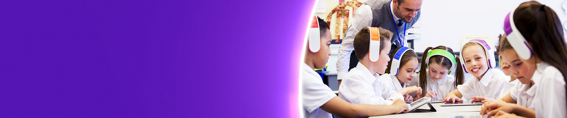 Teacher with pupils using tablet devices