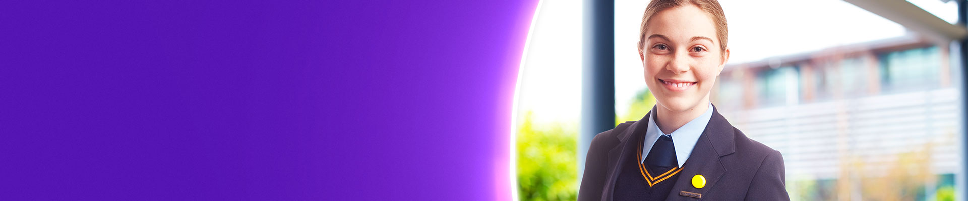 Girl student in unifrom standing outside independent school