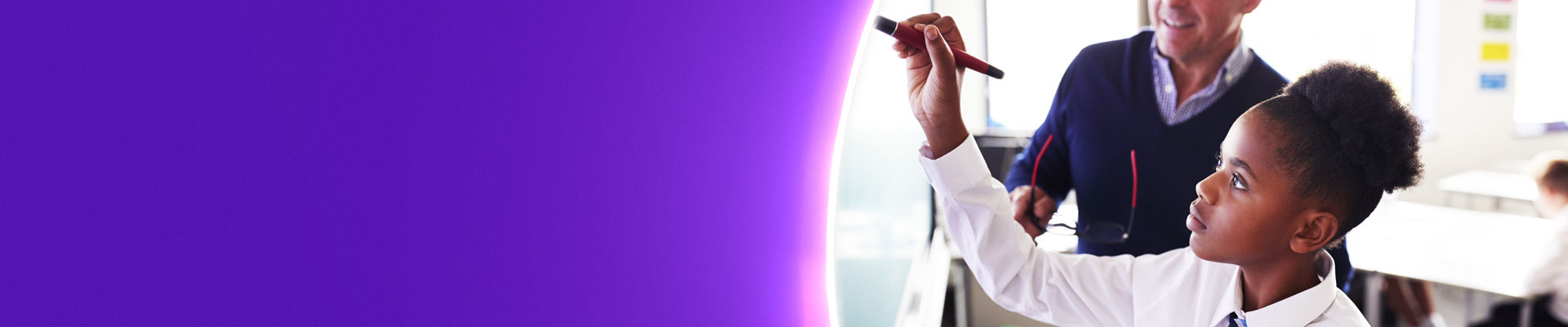 School girl writing on smartboard