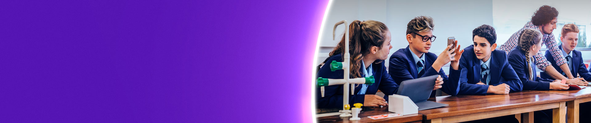 High school pupils on devices in science lesson